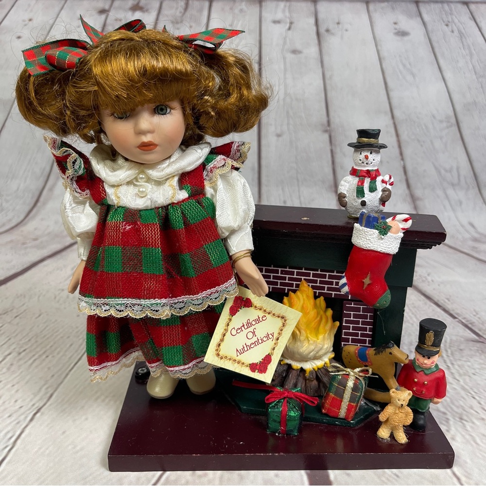 CLASSIC TREASURES Christmas collectible porcelain doll with fireplace and toys